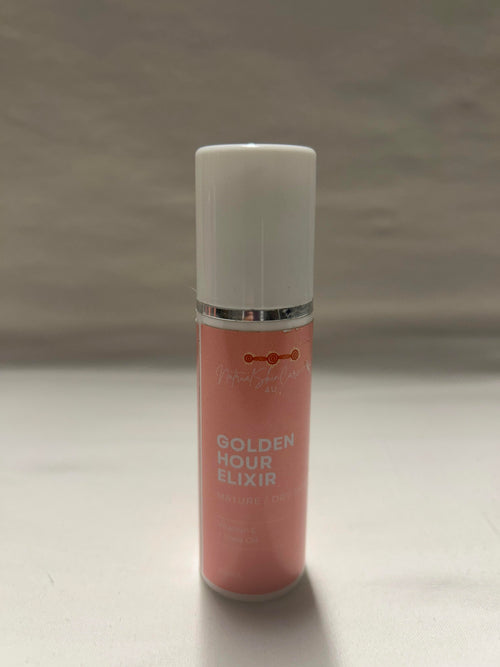 Pink bottle labeled 'Golden Hour Elixir' on a gray background