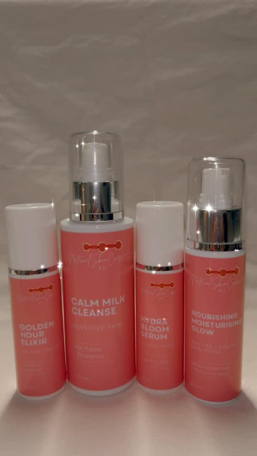 Set of 4 skincare products with visible branding on a plain background
